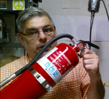 Keep a Fire Extinguisher by the door of your shop or work space, not near your bench. 